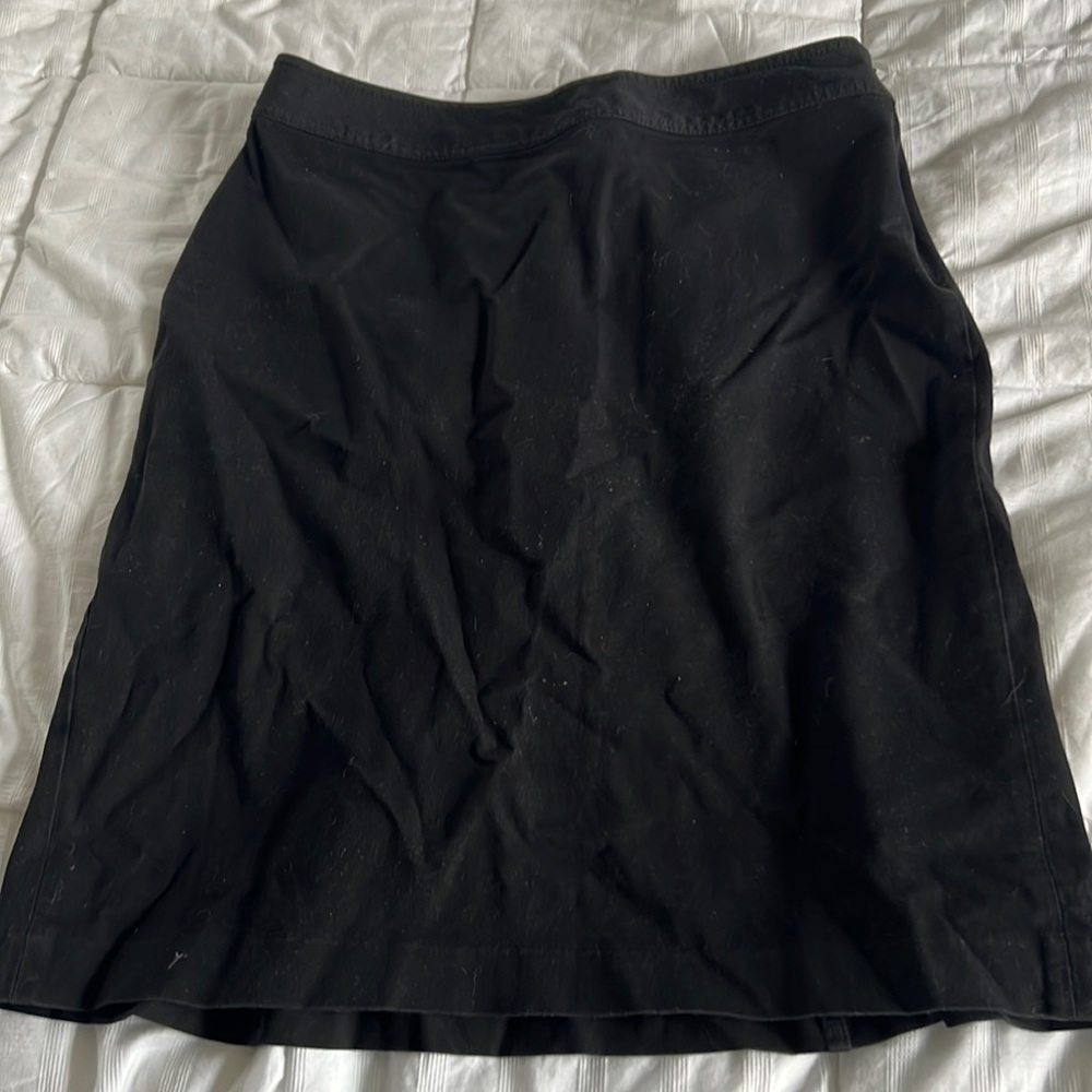 Gap black skirt, flares at bottom, detail on back with seam, so cute on! Size 12
